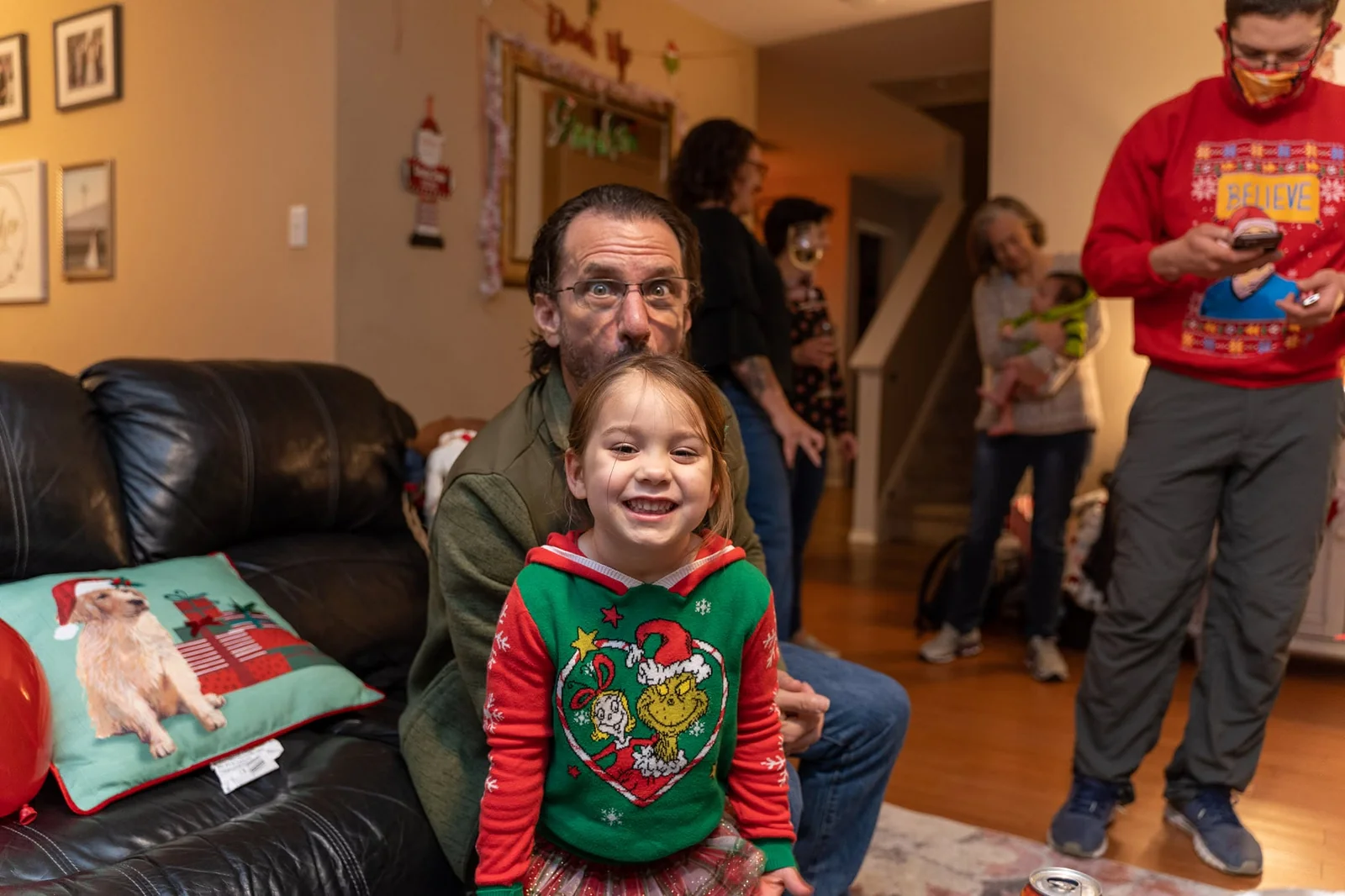 Larry with a smiling child at Christmas