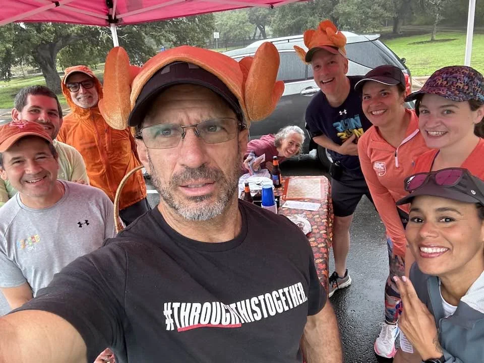 Larry in a turkey hat with the Sparks at a Turkey Trot